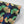 Ginkgo wallpaper by Tatie Lou in black, sample roll showing oversized ginkgo leaves