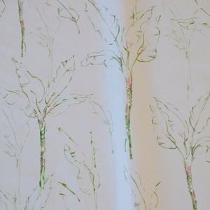 Tropical Paradise fabric by Seed Home Designs in green and beige, draped, showing slender tropical stems