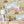 The Glitter Ranch wallpaper by Brand McKenzie in pink and blue, a desert ranch scene above a cabinet