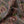 Garden of India velvet by Tatie Lou in brown and pink, draped, showing an Indian-style garden medallion