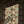 A Leopard Never Changes His Spots wallpaper by Annika Reed in cream, leaping leopards behind a sofa in a living room