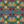 Hampi wallpaper by Tatie Lou in green, pattern sample of tropical flowers in a mirrored print