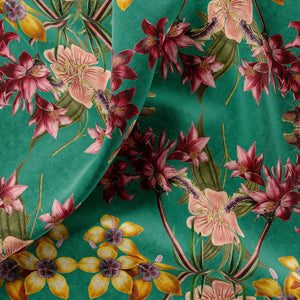 Hampi velvet by Tatie Lou in green, in soft folds showing tropical flowers in a mirrored print