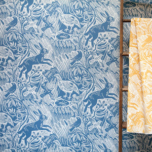 Harvest Hare wallpaper by St. Jude's in blue, pattern sample of hares among grasses