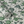 Hot Air Balloons wallpaper by Dami and Em Design in light green, partly unrolled roll showing hot-air balloons