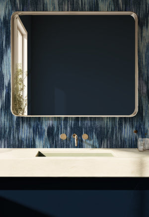 Spectre Ikat wallpaper by Victoria Sanders in blue, a blurred ikat design in a bathroom