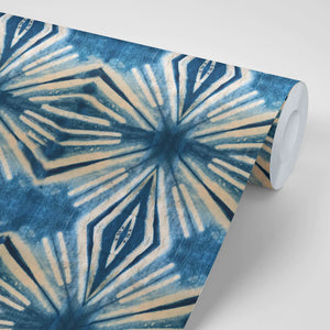 Indigo Itajime wallpaper by Tatie Lou in blue, partly unrolled roll showing itajime shibori folds