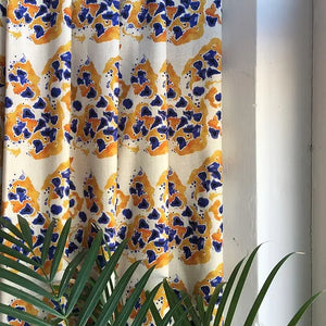 Inky linen by Bethie Tricks in blue and orange, inky blots made into curtains