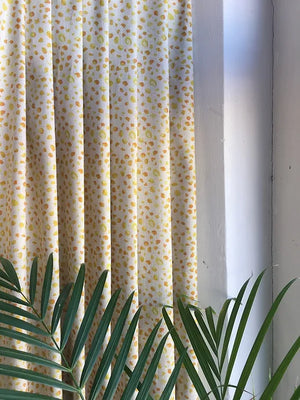 Inky linen by Bethie Tricks in yellow, inky blots as lined curtains