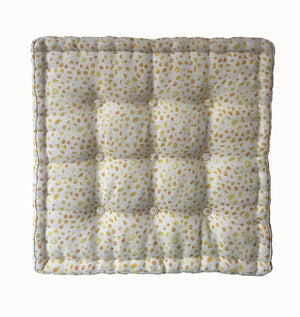 Inky linen by Bethie Tricks in yellow, inky blots on a scatter cushion
