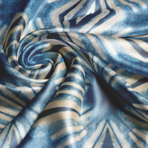 Indigo Itajime velvet by Tatie Lou in blue, draped, showing itajime shibori folds
