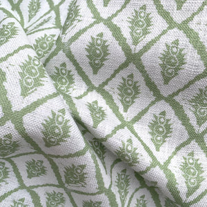 Jaipur linen by Annika Reed in green, draped, showing block-print medallions