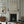 Jester Lines wallpaper by Annika Reed in blue, wavy jester lines around a fireplace