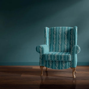 Gatty's Kelp Forest velvet by Annika Reed in teal, kelp fronds upholstered on an armchair