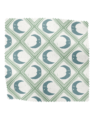 Kit Moon linen by Annika Reed in blue and green, full repeat of crescent moons in a lattice