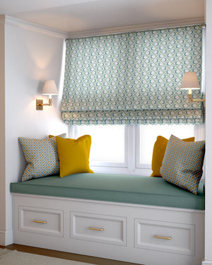 Kit Moon linen by Annika Reed in blue and green, crescent moons in a lattice as a roman blind