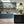 Kit Moon wallpaper by Annika Reed in blue and green, crescent moons in a lattice in a kitchen