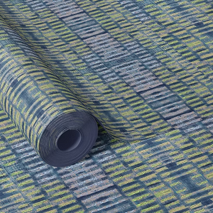Labyrinth grasscloth by Dami and Em Design in blue and yellow, roll showing a woven ikat design