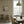A Leopard Never Changes His Spots wallpaper by Annika Reed in cream, leaping leopards in a dining area