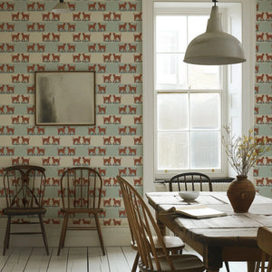 A Leopard Never Changes His Spots wallpaper by Annika Reed in cream, leaping leopards in a dining area