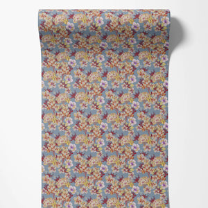 Les Fleurs wallpaper by Tatie Lou in pale blue, sample roll showing dense painterly flowers