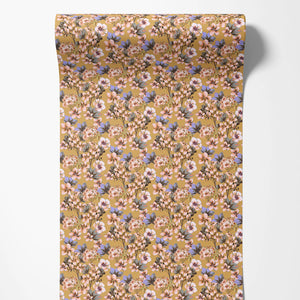 Les Fleurs wallpaper by Tatie Lou in yellow, partly unrolled roll showing dense painterly flowers
