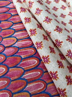 Lilo linen by Bethie Tricks in pink and red, draped, showing scalloped stripes