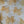 Winged Lion linen by Annika Reed in mustard, draped, showing winged lions