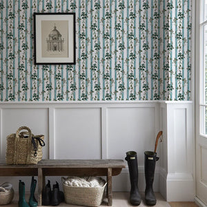 Little Fiorita Stripe wallpaper by Deus ex Gardenia in teal and white, floral vine stripes in a hallway