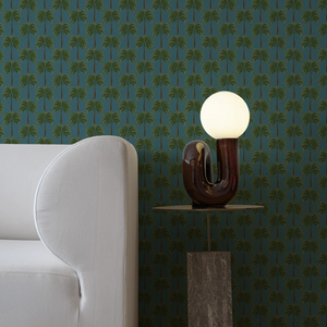 Little Palma vinyl wallpaper by Deus ex Gardenia in teal, rows of palm trees in a living room