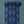 Lotus wallpaper by Tatie Lou in blue, partly unrolled roll showing lotus birds