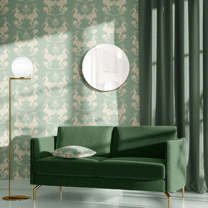 Lotus wallpaper by Tatie Lou in mint green, lotus birds behind a sofa in a living room