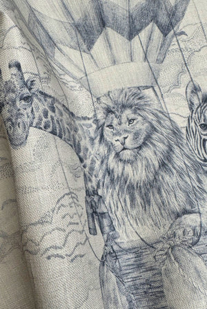 Lyons Den linen by Victoria Sanders in pale blue, close view of a hot-air balloon and safari toile