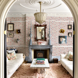 Madria wallpaper by Deus ex Gardenia in pink, dense flowers in a living room