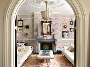 Madria wallpaper by Deus ex Gardenia in pink, dense flowers in a living room