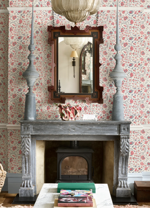 Madria wallpaper by Deus ex Gardenia in pink, dense flowers around a fireplace