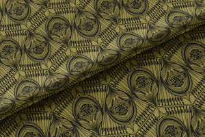 Manilva Garden velvet by Dami and Em Design in gold and green, draped, showing an art deco garden design