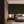 Manilva Garden wallpaper by Dami and Em Design in green, an art deco garden design behind a bed