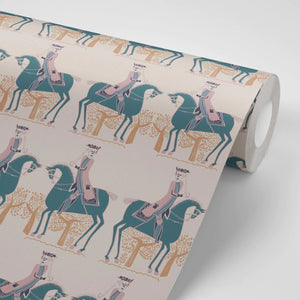 Red Coat wallpaper by Annika Reed in teal and red, partly unrolled roll showing riders on horseback