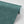 Margaux wallpaper by Tatie Lou in teal, partly unrolled roll showing marbled swirls