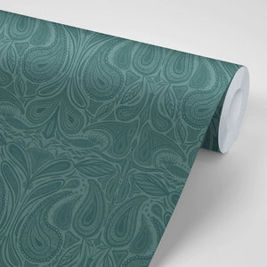 Margaux wallpaper by Tatie Lou in teal, partly unrolled roll showing marbled swirls