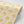 Marigold wallpaper by Annika Reed in yellow, roll showing marigold flowers