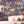 Mayhem Mansion wallpaper by Brand McKenzie in blue, animals partying in a mansion in a living room