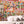 Mayhem Mansion wallpaper by Brand McKenzie in orange and pink, close view of animals partying in a mansion