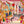 Mayhem Mansion wallpaper by Brand McKenzie in orange and pink, pattern detail of animals partying in a mansion