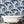 Mermaids wallpaper by Dupenny in navy, mermaids and waves on a bathroom wall