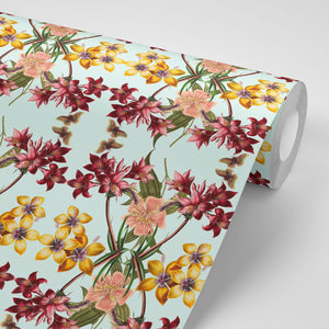 Hampi wallpaper by Tatie Lou in mint green, pattern sample of tropical flowers in a mirrored print