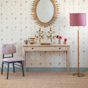 Mitford wallpaper by Parker and Jules in beige, scattered flower sprigs above a sideboard