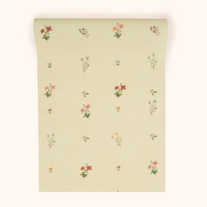 Mitford wallpaper by Parker and Jules in beige, roll showing scattered flower sprigs