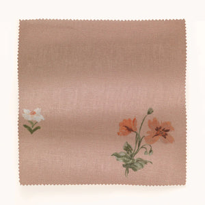 Mitford linen by Parker and Jules in pink, in soft folds showing scattered embroidered flowers